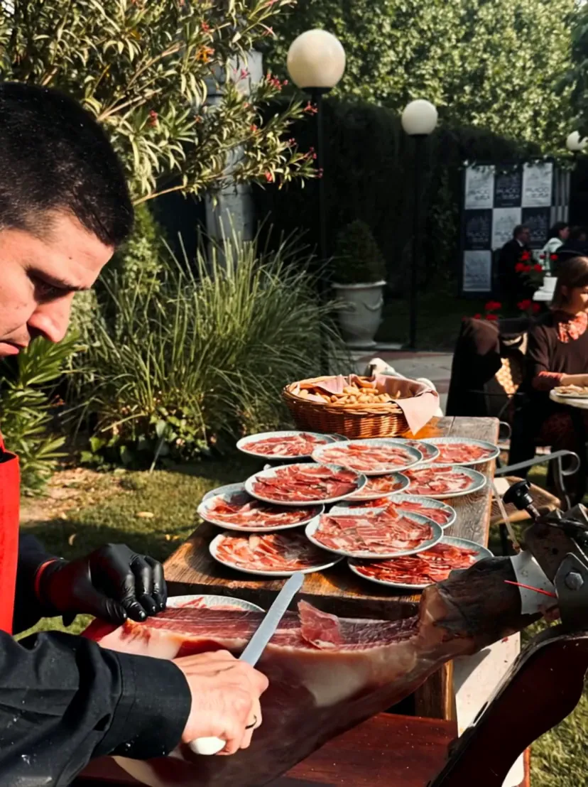A cortador carving jamón ibérico by hand